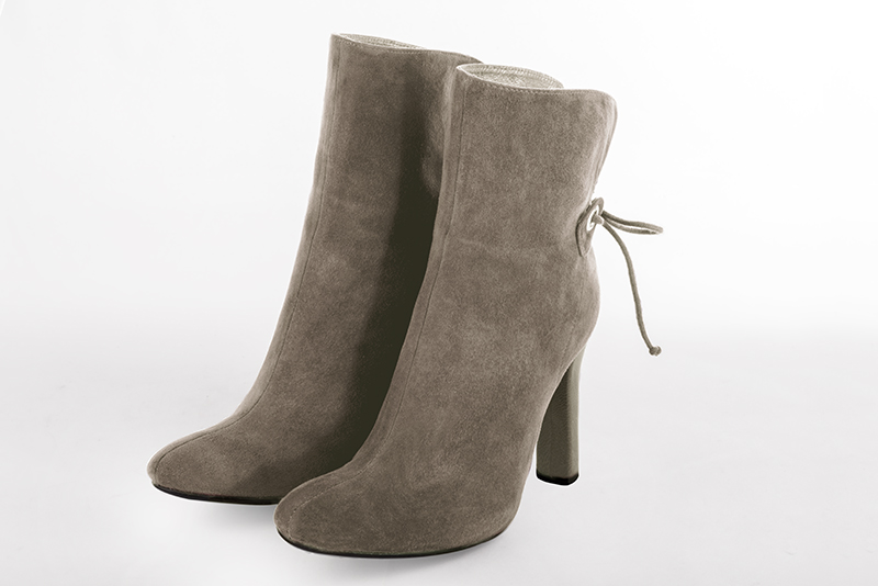 Women's taupe brown elegant ankle boots, with laces at the back. Round toe. High kitten heels - Front view